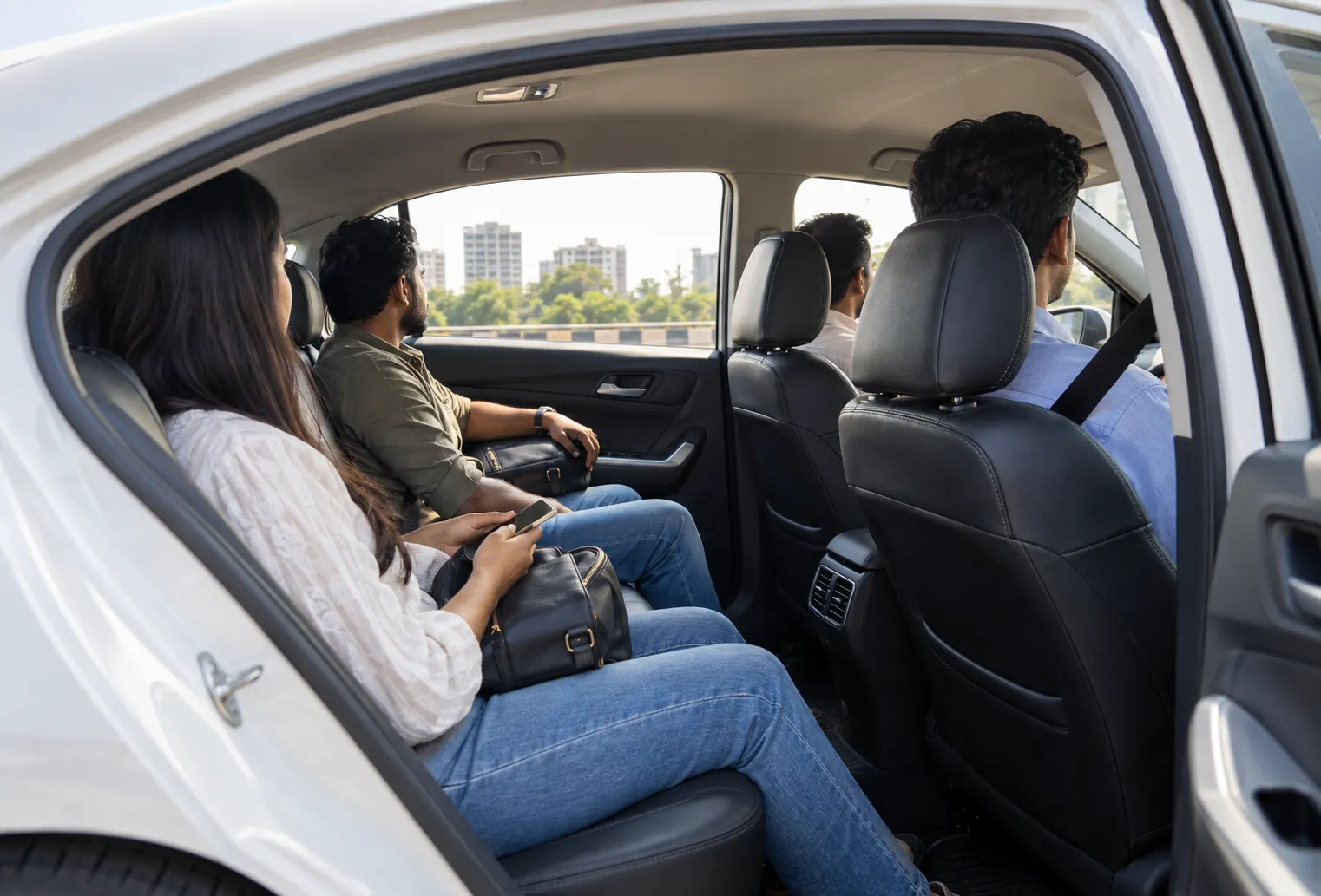 Separate passengers sharing an intercity ride in a sedan